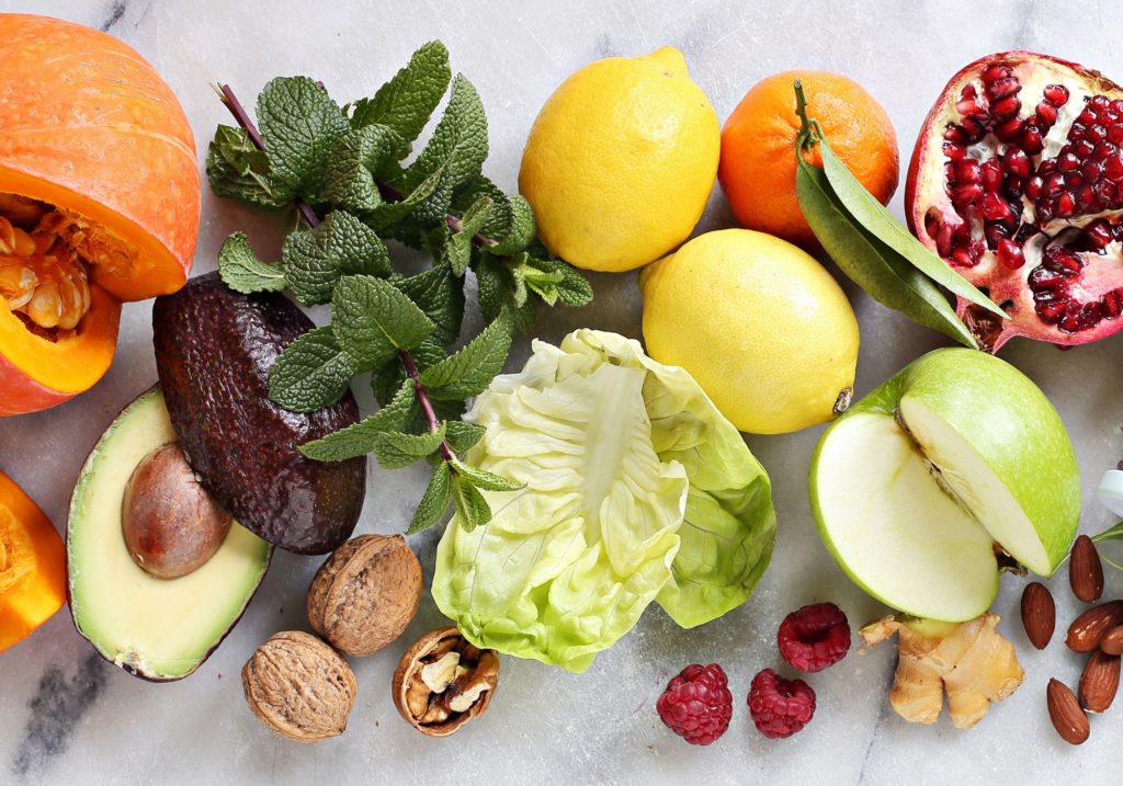 An array of different plant based fruits, vegetables and nuts
